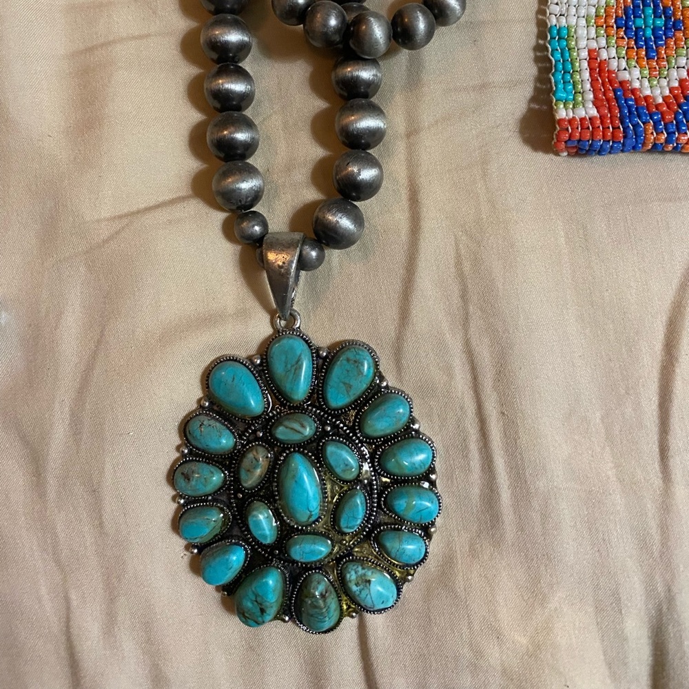 Faux turquoise squash blossom